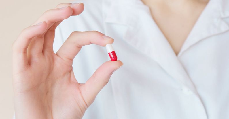 Remedies - Crop nurse demonstrating small double colored pill